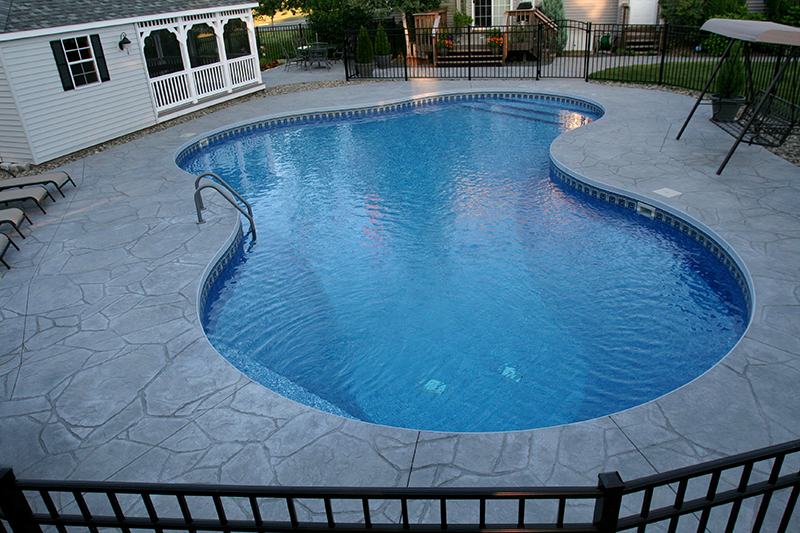 Swimming pool and stamped concrete project example 65